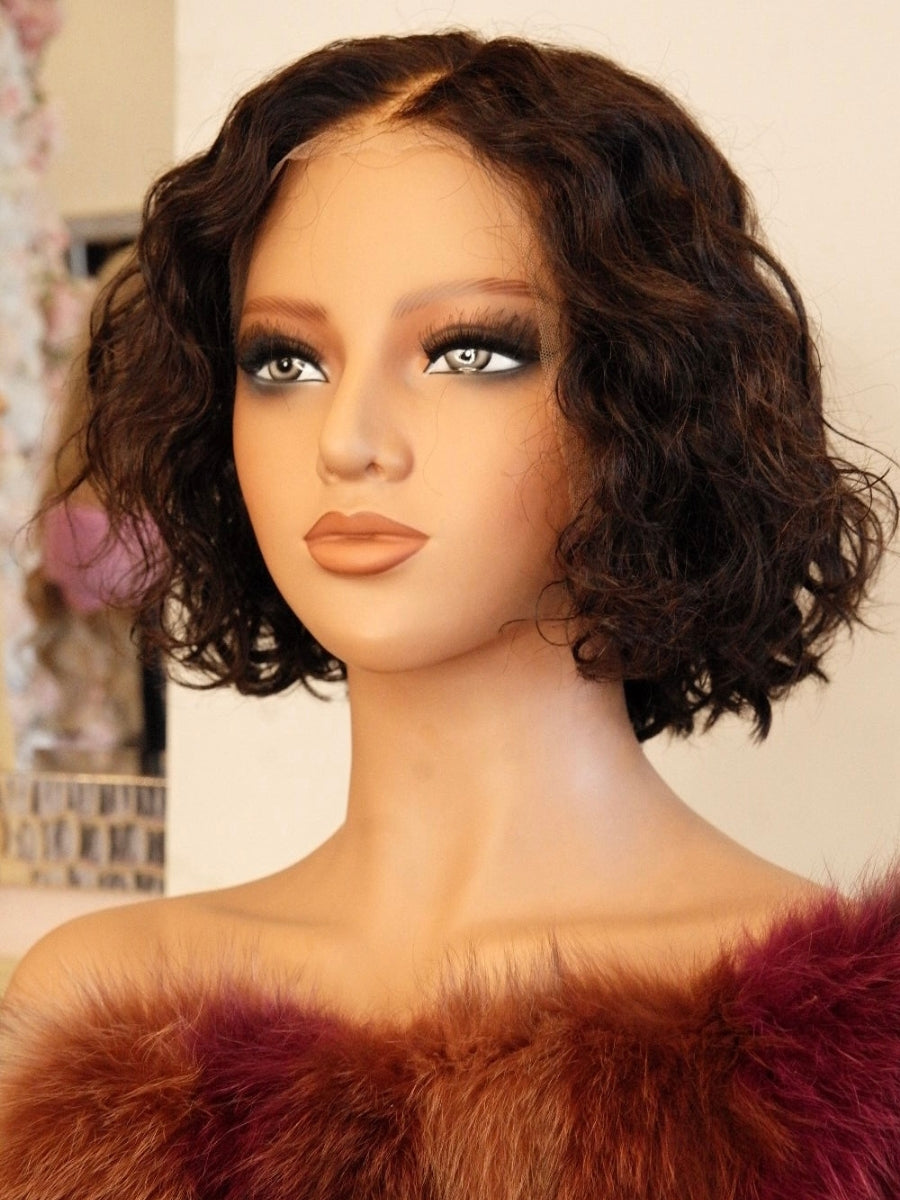 Premium 100% human hair Estelle Curly Wig featuring voluminous natural curls, pre-bleached knots, and baby hair detailing by Wigs R Us Toronto