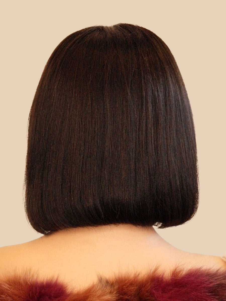 Side profile of glueless Midnight Elegance Bob Wig with bangs, 12-inch black human hair, adjustable cap size from Wigs R Us Toronto